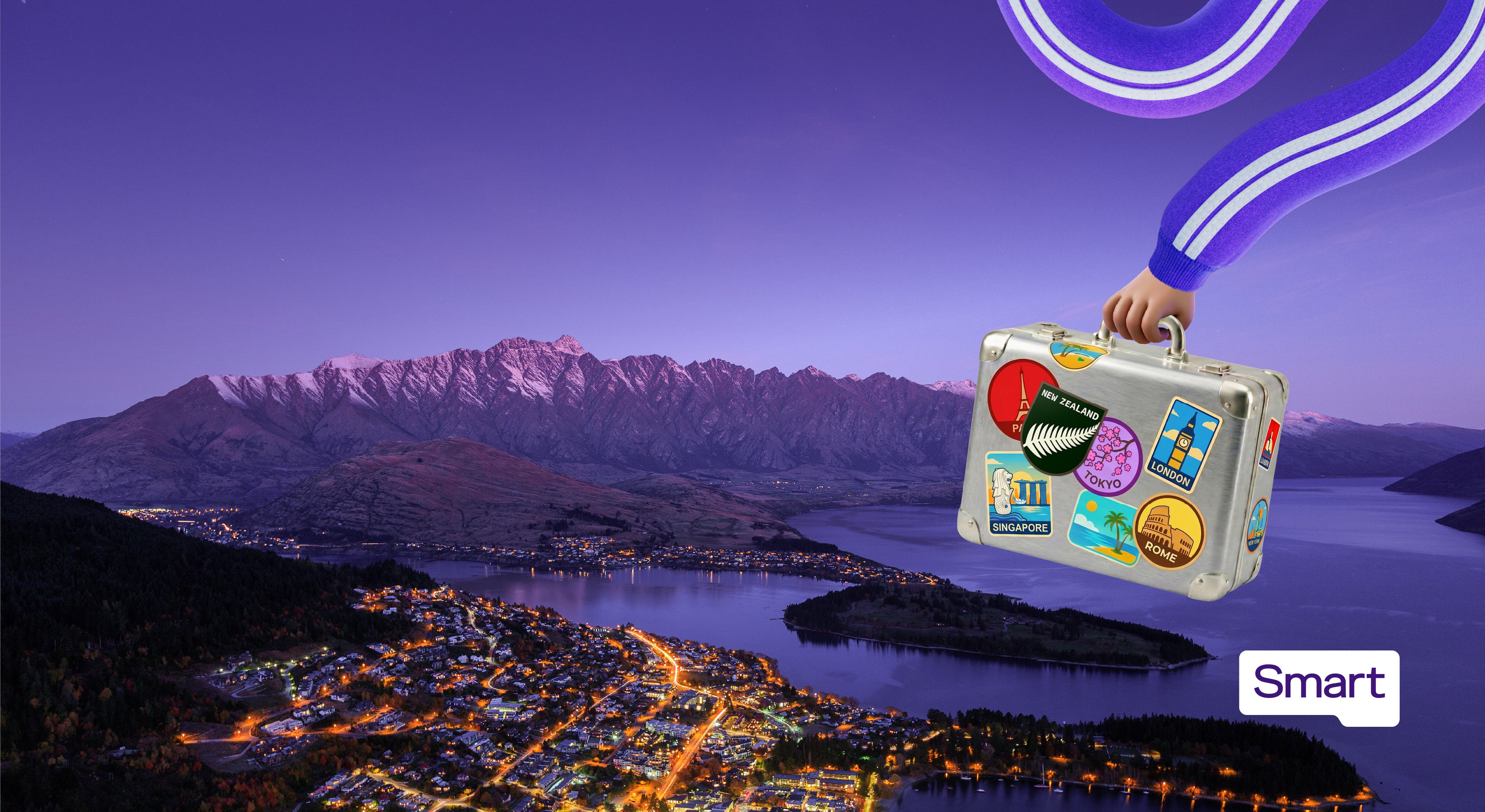 Hand holding a travel-stickered suitcase over Queenstown, New Zealand, with the Smart logo