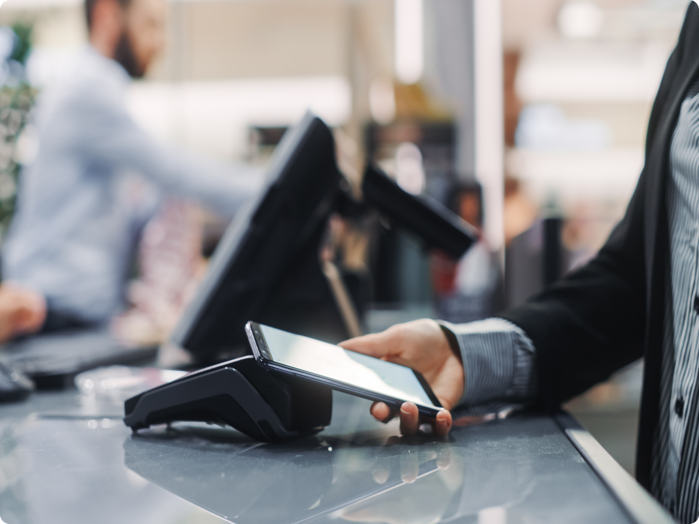 Person using digital salary packaging card at EFTPOS machine