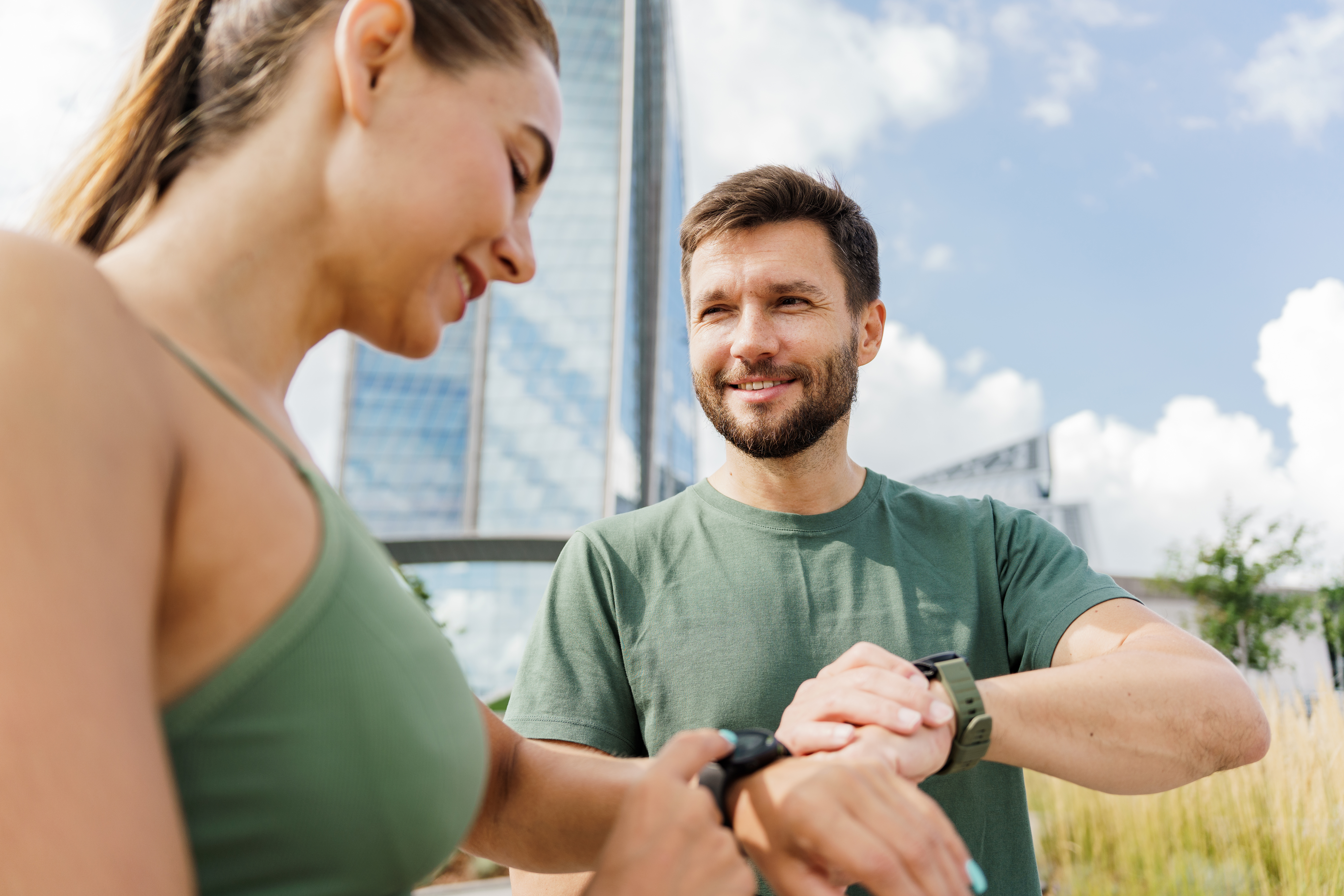Couple comparing smartwatches