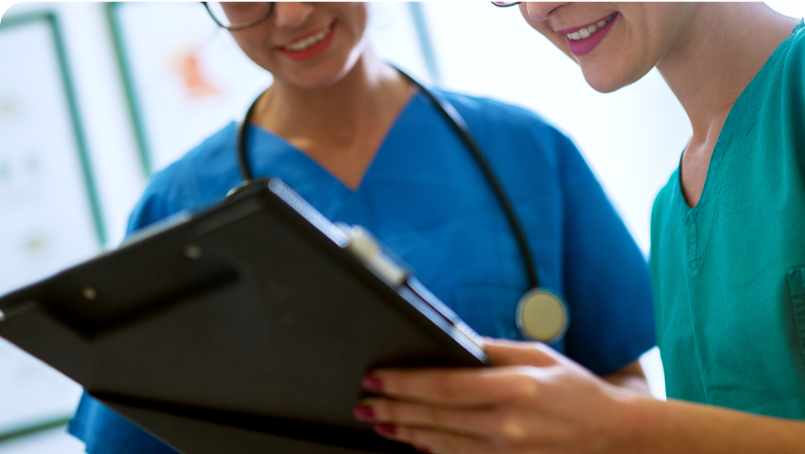 Healthworkers having a discussion over a medical file