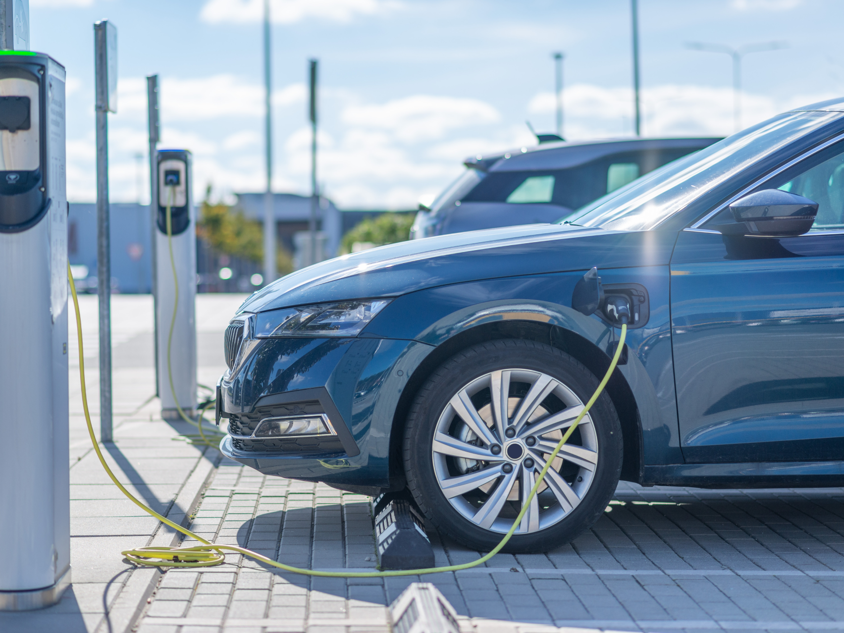 Side view of an EV on charge 