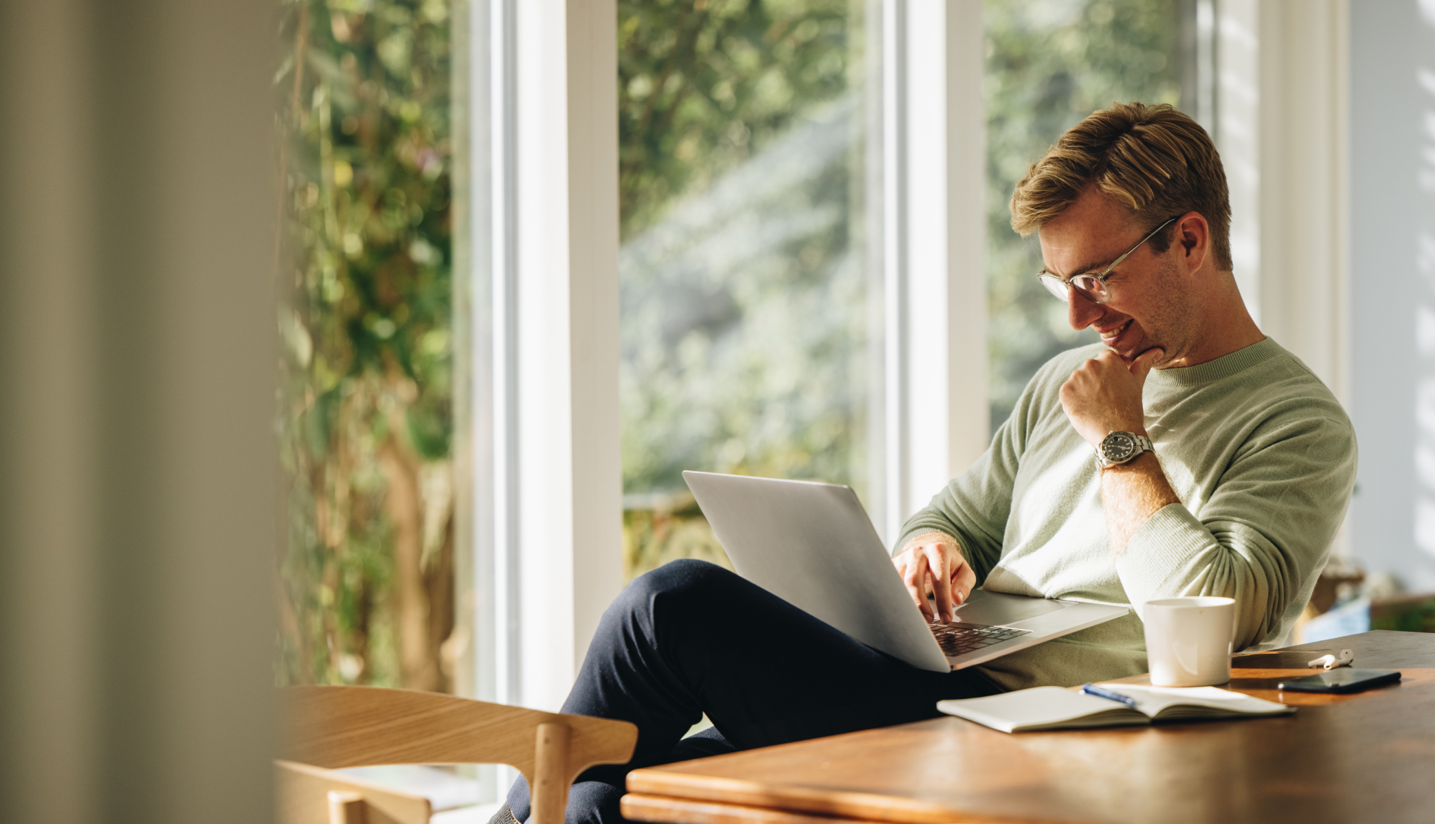 man looking at laptop at home