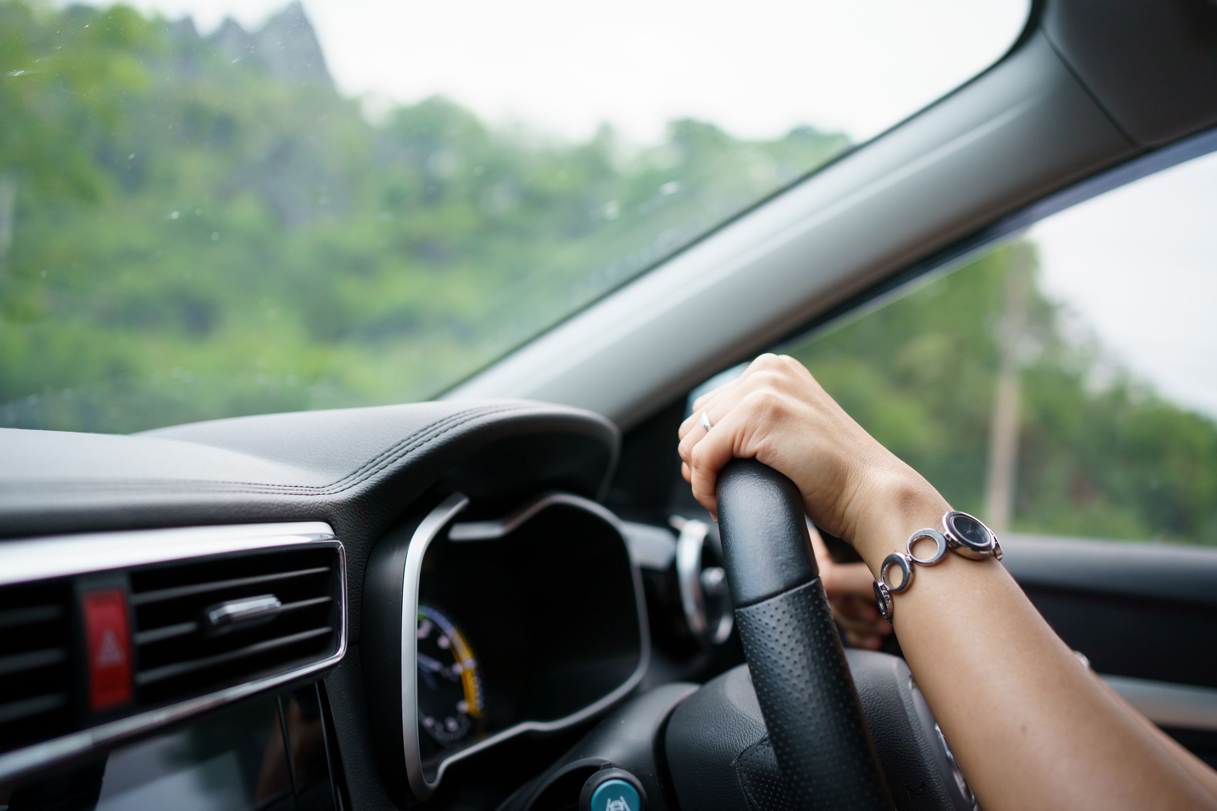 close-up-of-dashboard-with-someone-driving.jpg