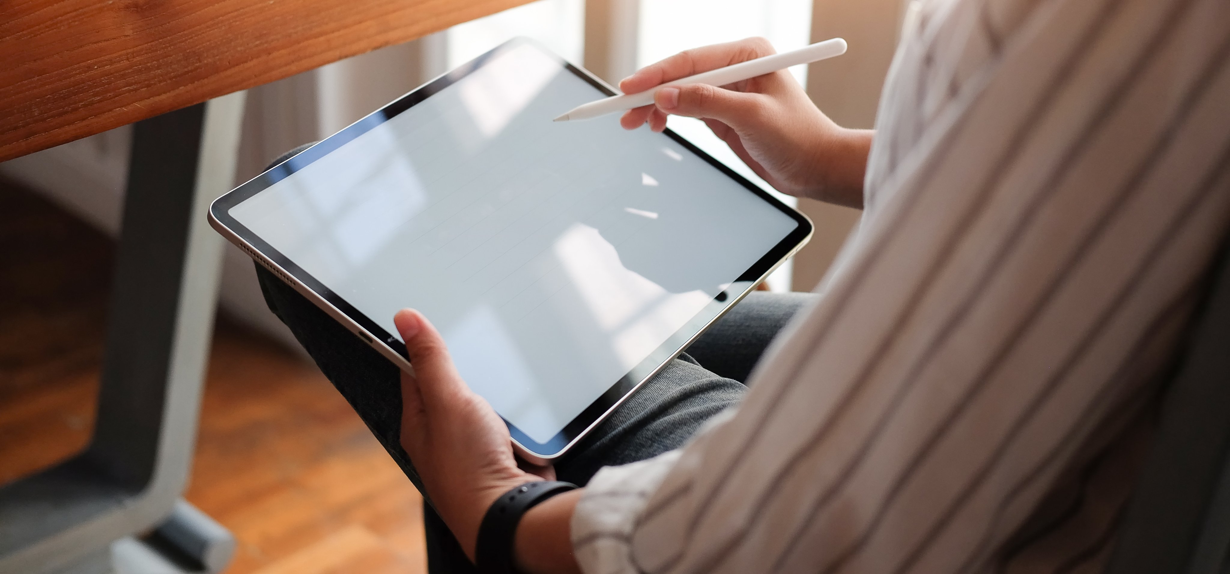 Teacher using tablet to view salary packaging benefits