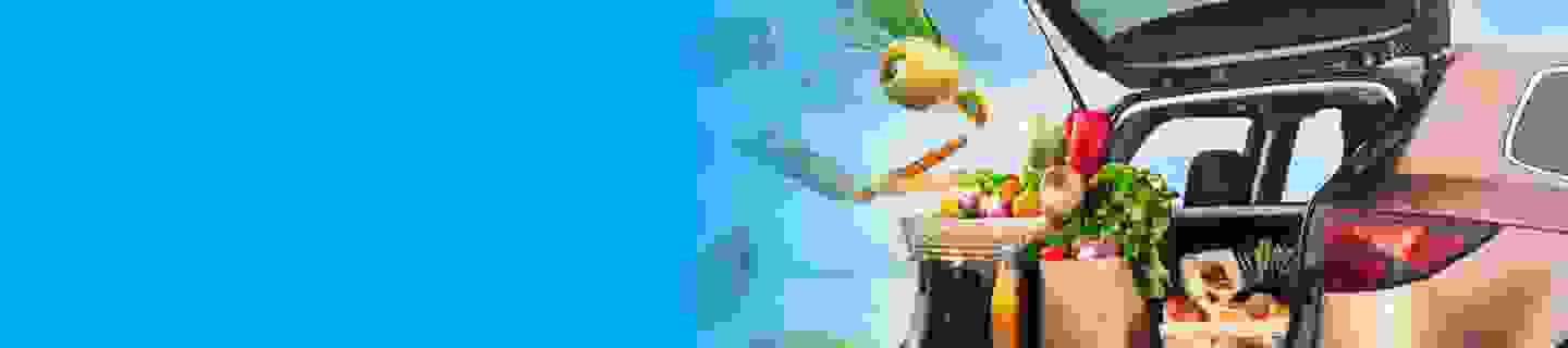 Groceries flying out of the boot of a car
