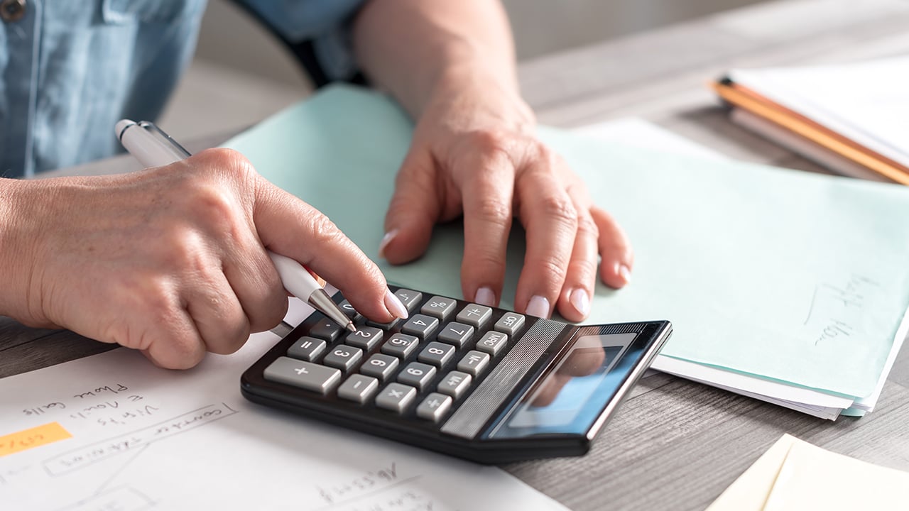 man using a calculator