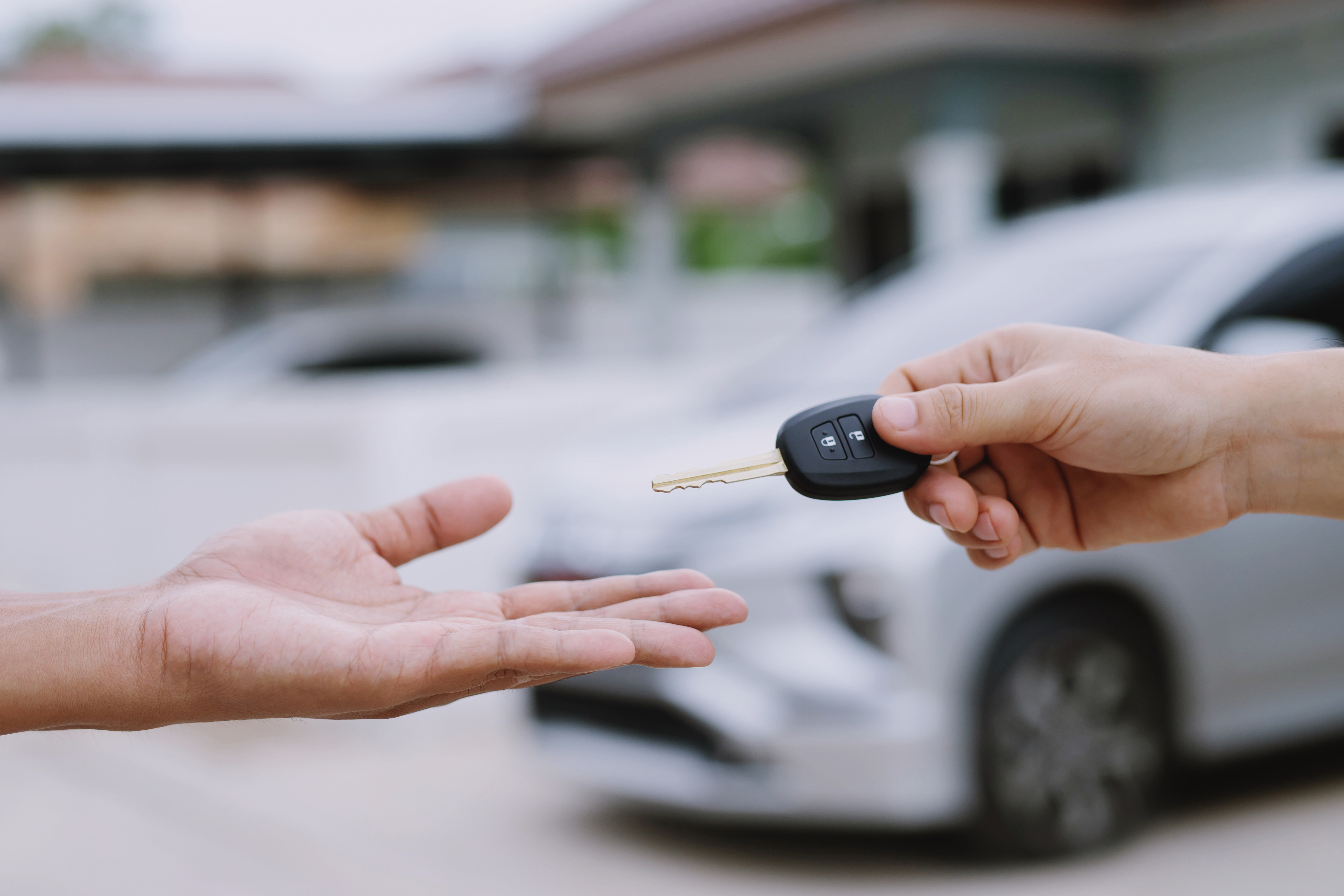 handing over a car key