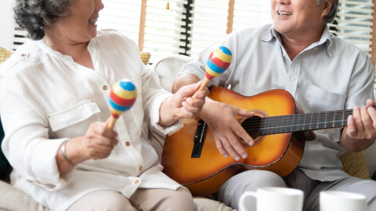 Senior couple with guitar and maracas